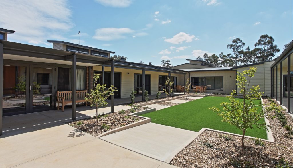 Southern Cross Care Parkes Village, homes and grass courtyard